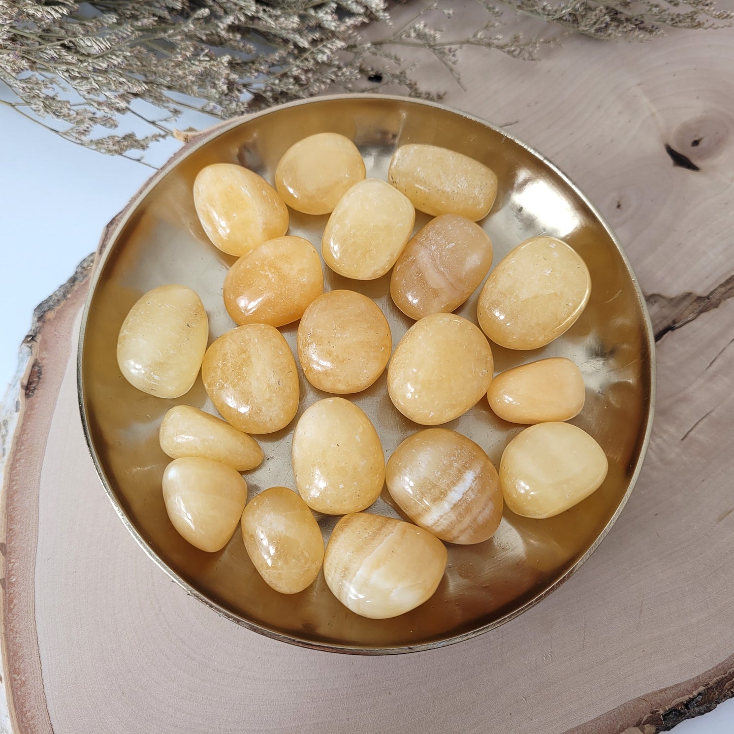 Orangencalcit Trommelstein