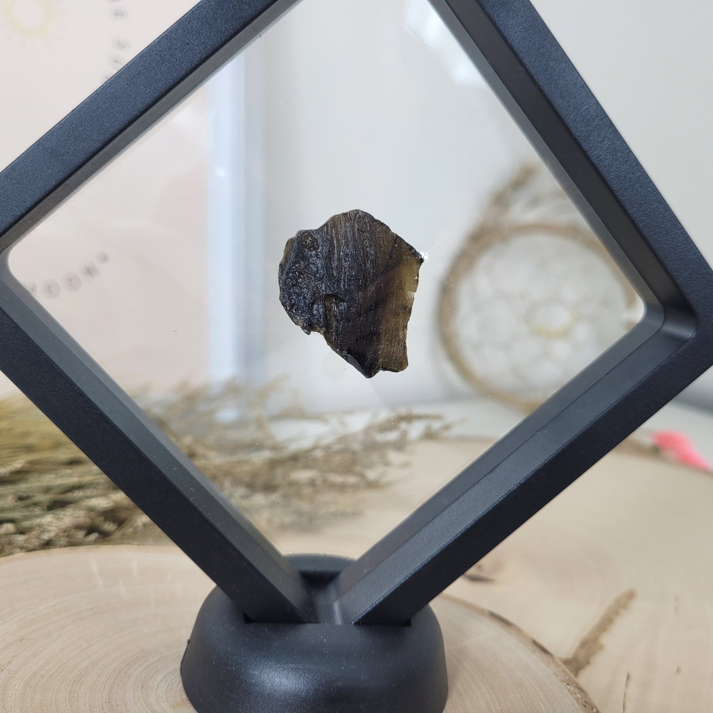 Tektit 2-3cm im Schweberahmen